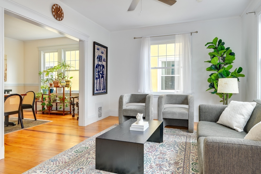48 Crescent Street, Unit 2 Cambridge, MA 02138 - Photo 2 of 17 a living room with furniture and a large window