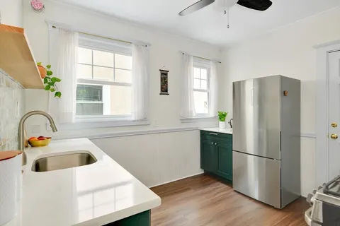 a bedroom with bed and window