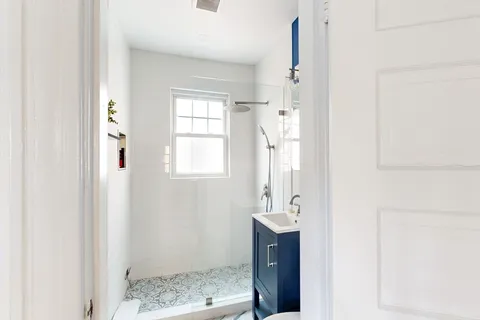 a bedroom with bed and a window