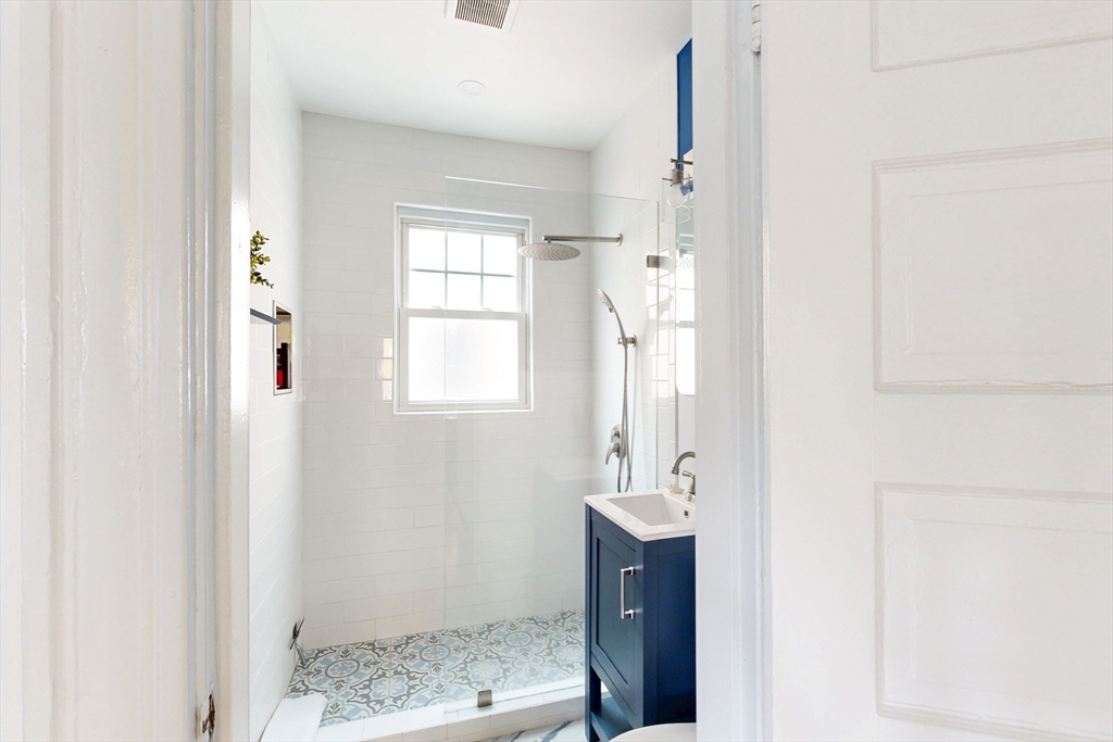 48 Crescent Street, Unit 2 Cambridge, MA 02138 - Photo 10 of 17 a bathroom with a sink and a mirror