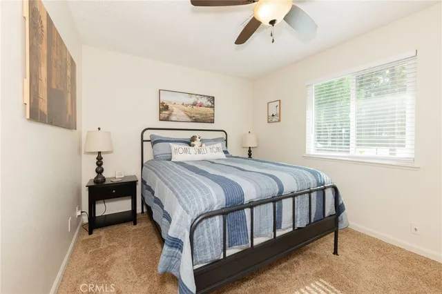 a bedroom with a bed and window