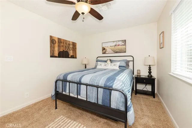 a bedroom with a bed and window