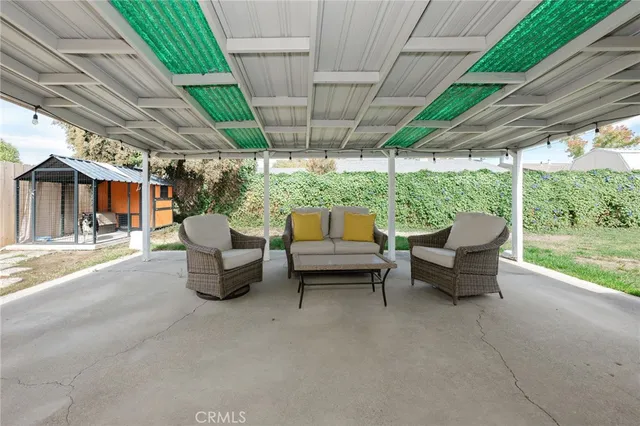 a balcony with furniture and a garden