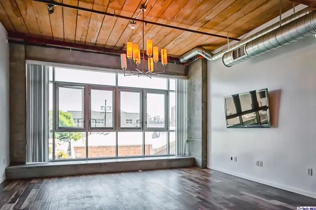 a view of a large window with wooden floor