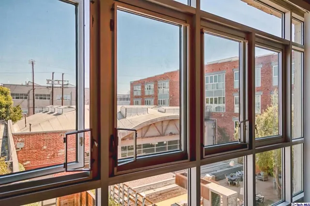 a view of a large window with wooden floor