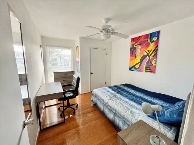 a bedroom with furniture and a window