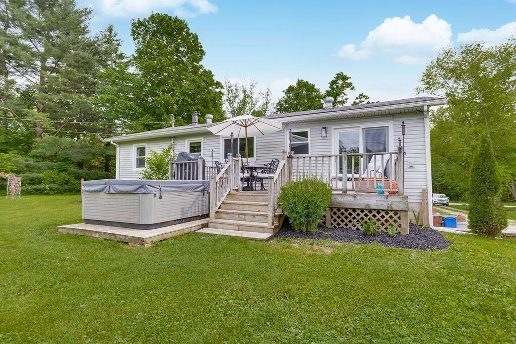 4065 Harlem Road Galena, OH 43021 - Photo 41 of 64 back of home with deck and hot Tub