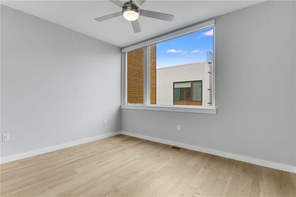 2002 East 7th Street, Unit 212 Austin, TX 78702 - Photo 11 of 23 a view of an empty room with a window