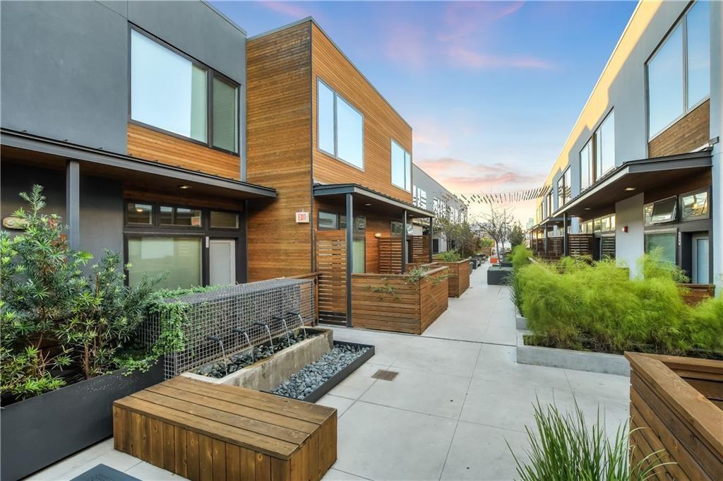 2002 East 7th Street, Unit 212 Austin, TX 78702 - Photo 14 of 23 a front view of a house with garden