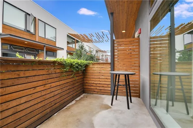 a view of a balcony with chairs