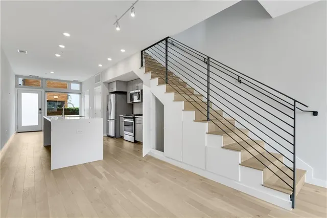 a view of kitchen with furniture and wooden floor