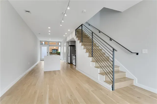 a view of entryway with wooden floor