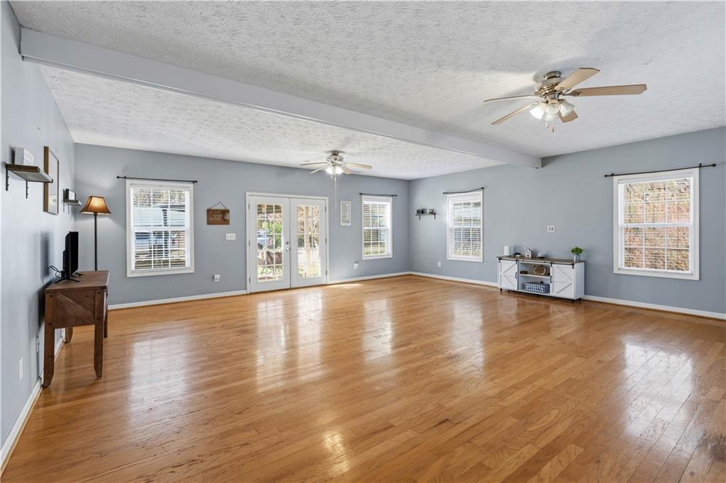 7540 County Line Road Lula, GA 30554 - Photo 23 of 62 a view of an empty room with wooden floor and a window