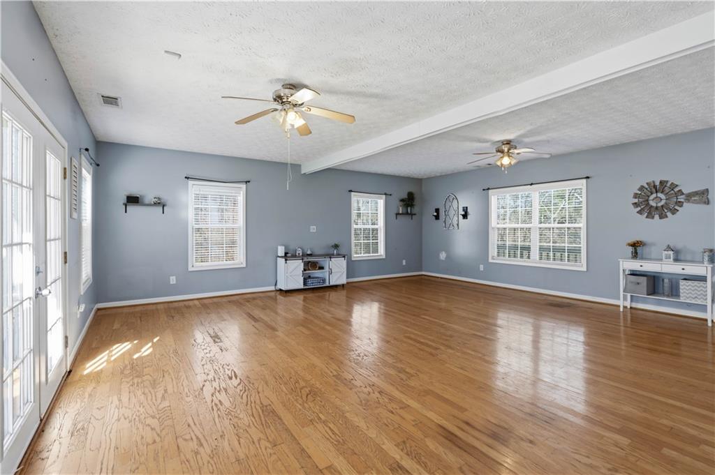 7540 County Line Road Lula, GA 30554 - Photo 24 of 62 a view of an empty room with wooden floor and a window