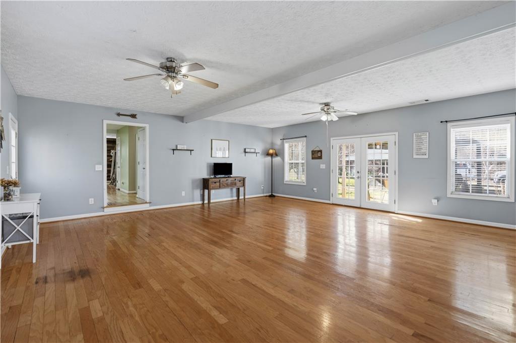 7540 County Line Road Lula, GA 30554 - Photo 25 of 62 a view of an empty room with wooden floor and a window