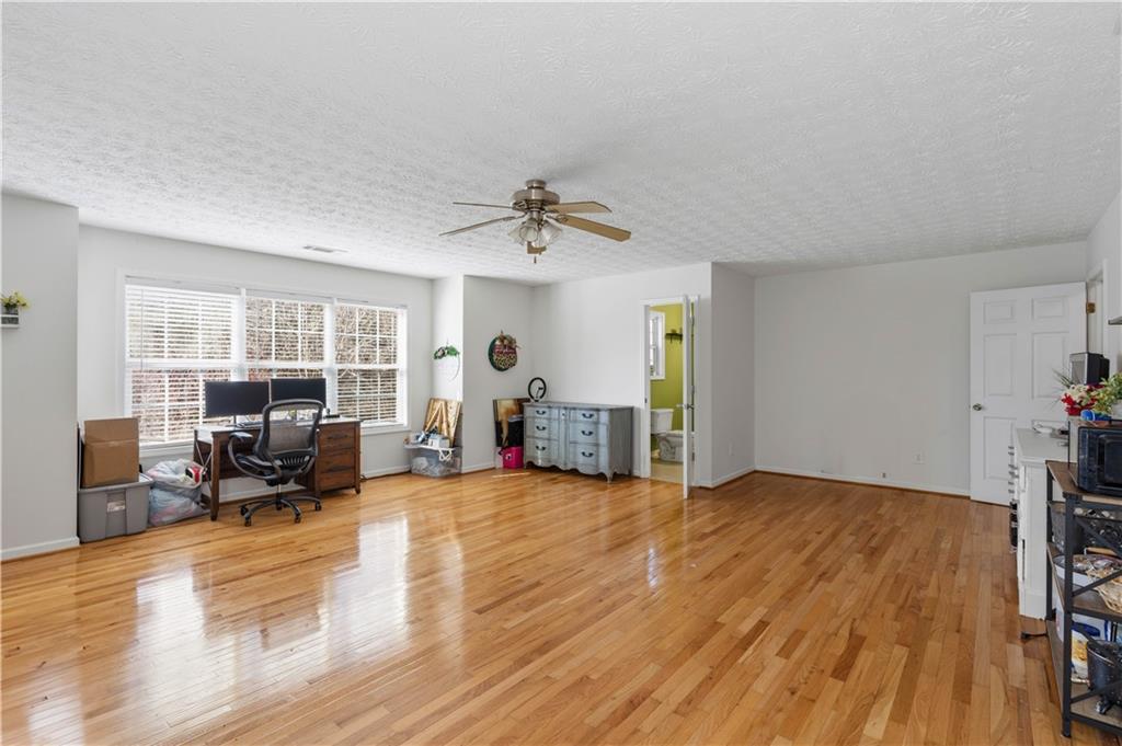 7540 County Line Road Lula, GA 30554 - Photo 28 of 62 a living room with furniture and a wooden floor