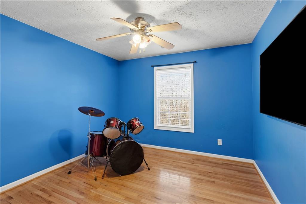 7540 County Line Road Lula, GA 30554 - Photo 37 of 62 a room with furniture and a flat screen tv