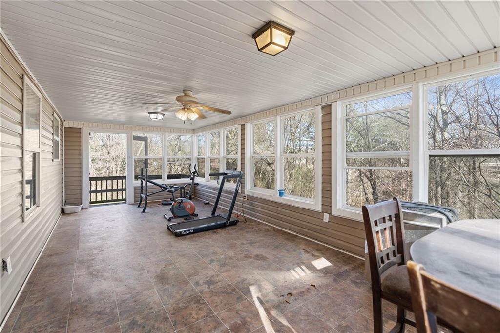 7540 County Line Road Lula, GA 30554 - Photo 39 of 62 a living room with furniture and a large window