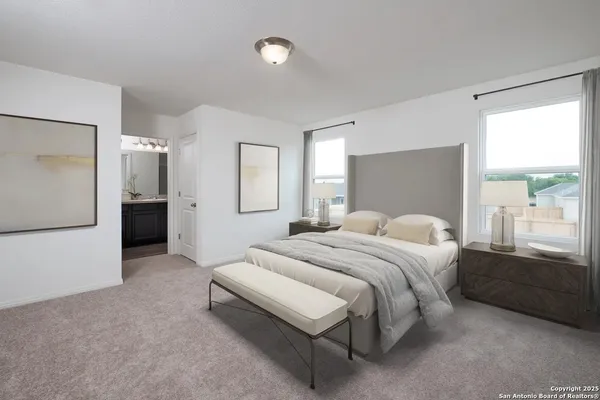 a spacious bedroom with a bed and a window