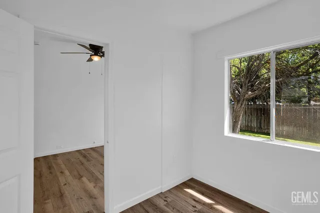 a view of a hallway with a window