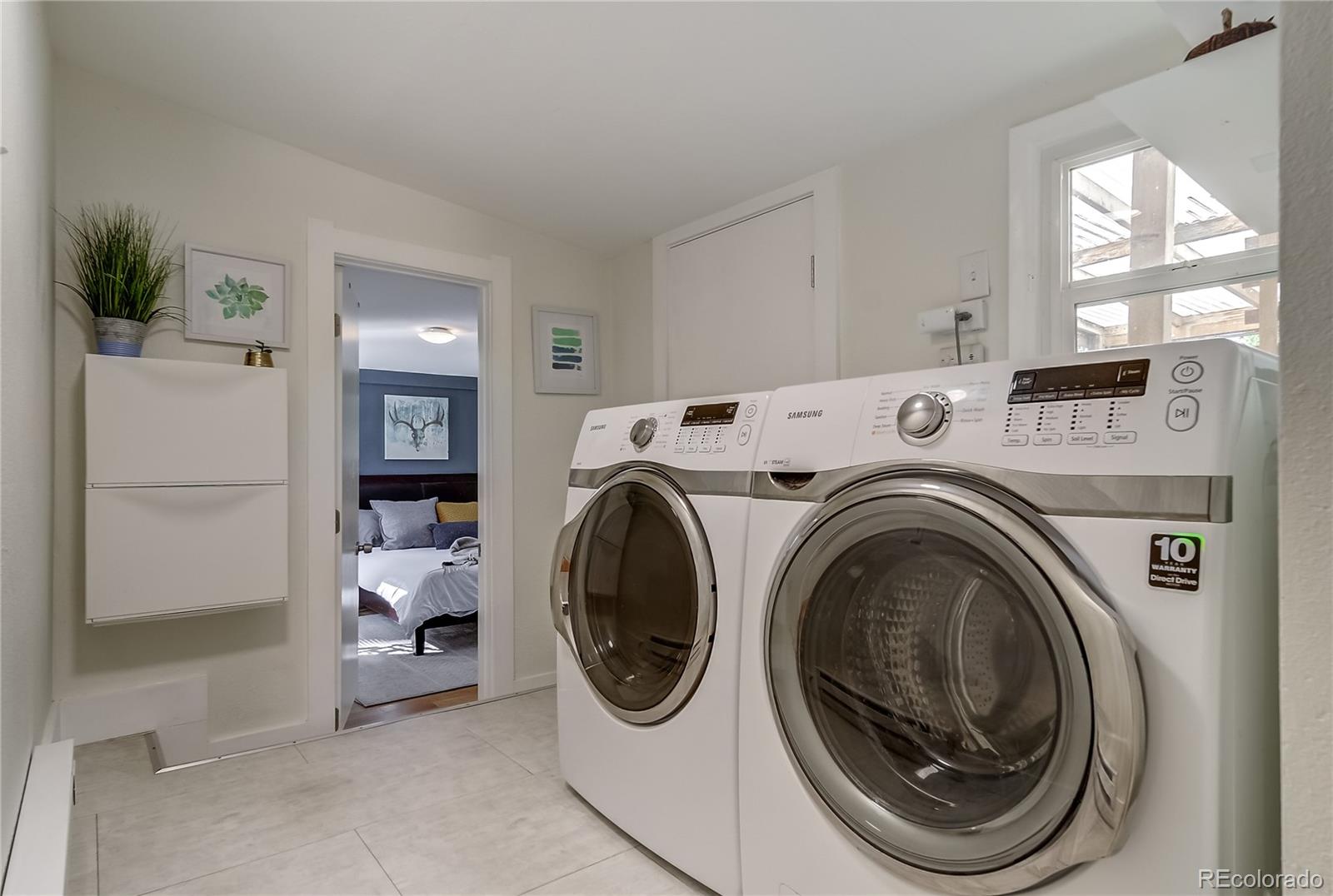 5129 Zuni Street Denver, CO 80221 - Photo 26 of 40 a utility room with dryer and washer