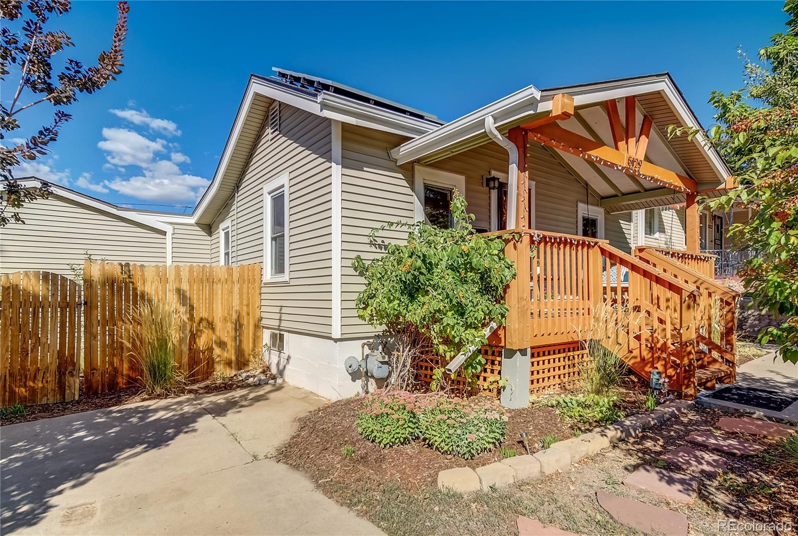 5129 Zuni Street Denver, CO 80221 - Photo 3 of 40 a view of a house with a yard