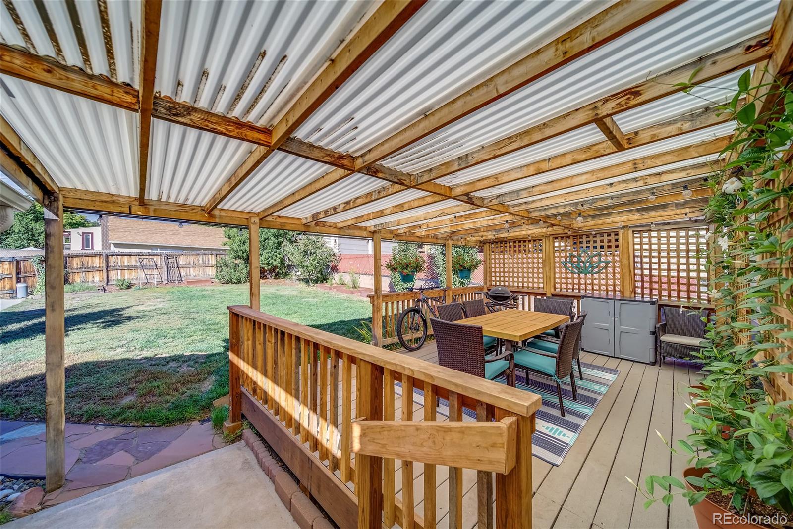 5129 Zuni Street Denver, CO 80221 - Photo 33 of 40 a view of a chair and tables in the balcony