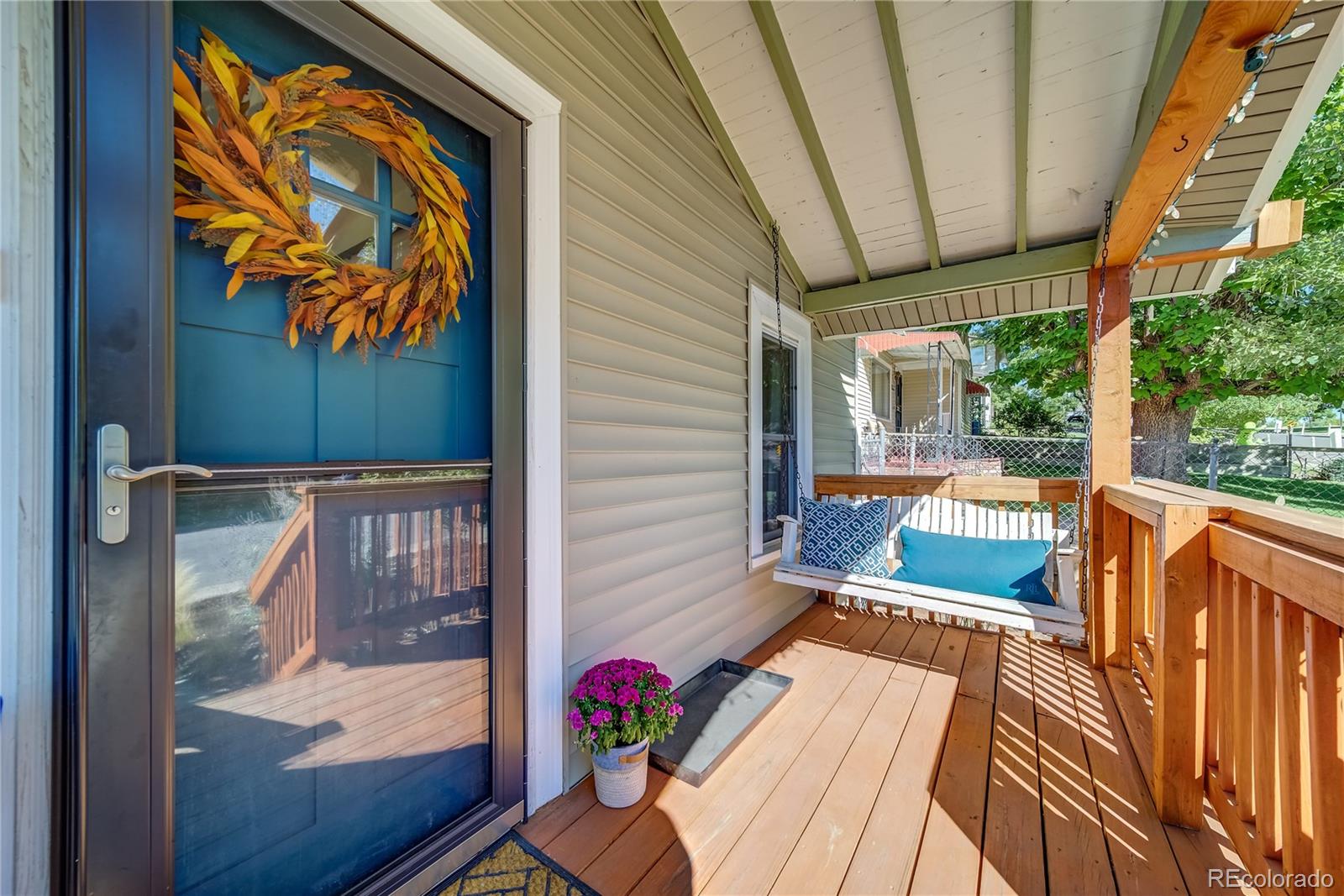 5129 Zuni Street Denver, CO 80221 - Photo 7 of 40 a view of deck with furniture and garden