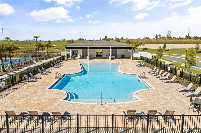 a view of a swimming pool with an ocean view