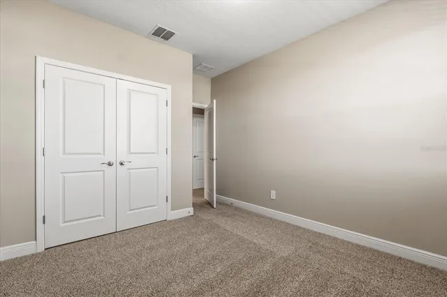 a bathroom with a double vanity sink toilet and shower