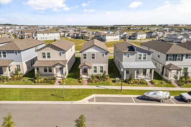 an aerial view of a residential building with an ocean view