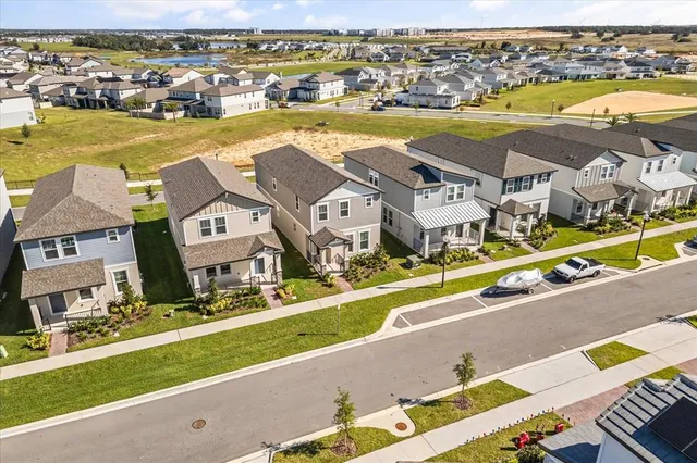 view of an ocean with residential houses