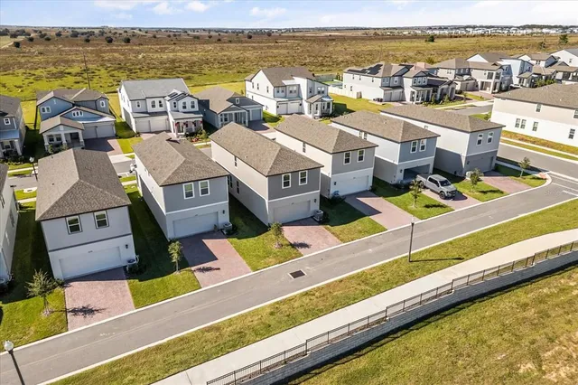 a view of houses with an outdoor space and lakeside
