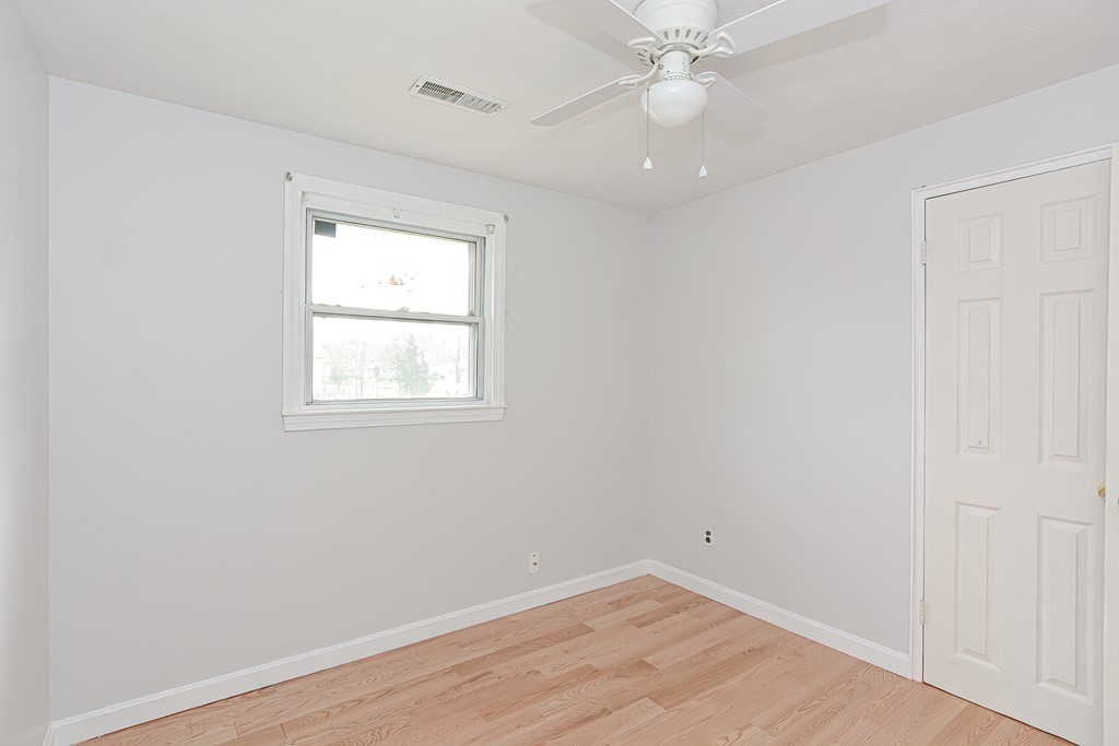 70 Roseen Road Holbrook, MA 02343 - Photo 25 of 35 wooden floor in an empty room with a window