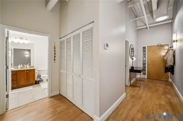 a view of a room with wooden floor