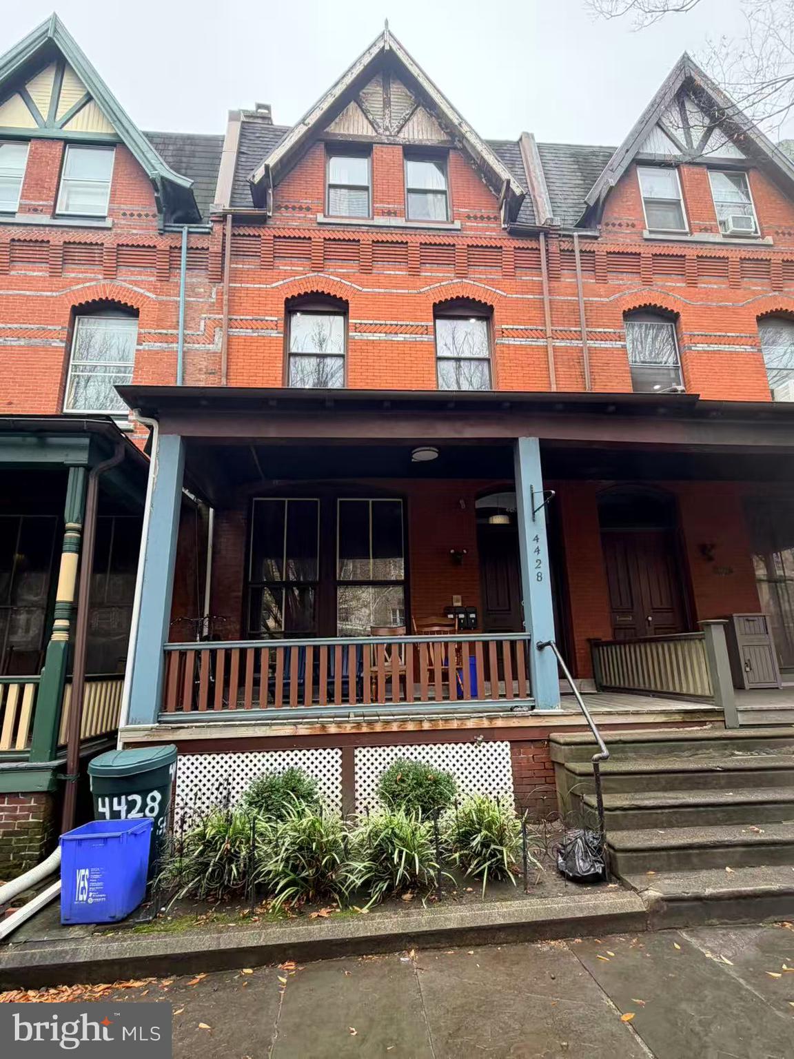 4428 Chestnut Street, Unit 2F Philadelphia, PA 19104 - Photo 7 of 7 front view of a house with a small yard