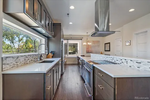 a kitchen with a stove and a refrigerator