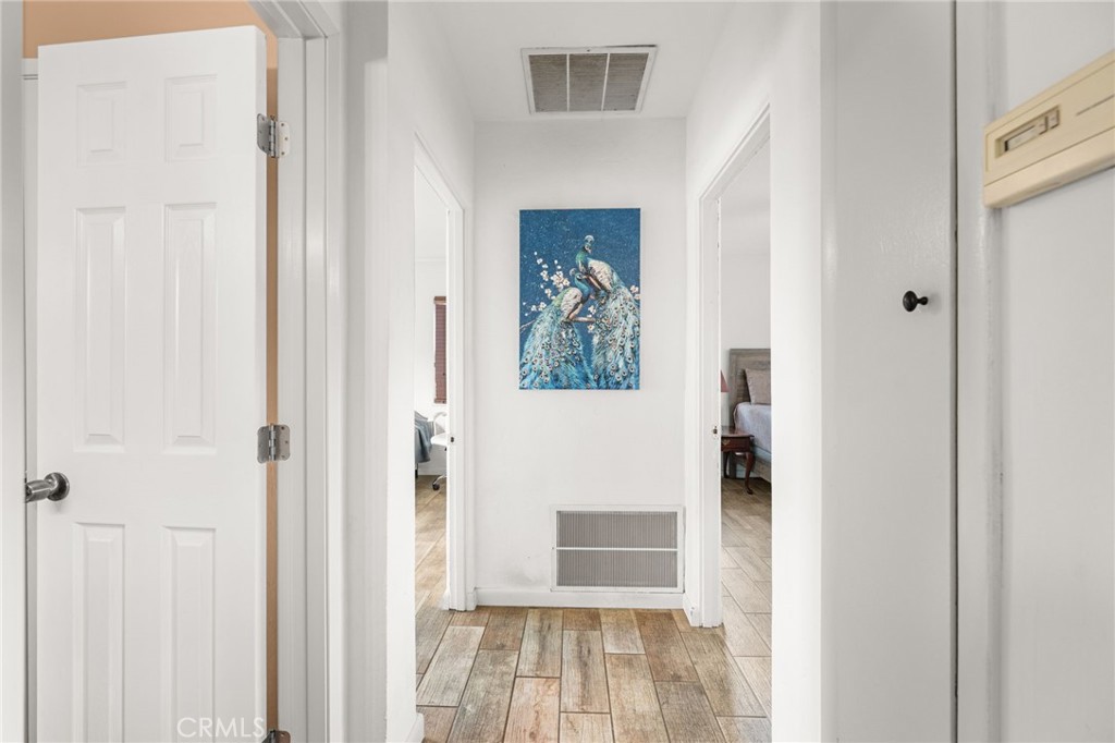 3620 Hoover Street Riverside, CA 92504 - Photo 11 of 44 a view of a hallway with wooden floor and entryway