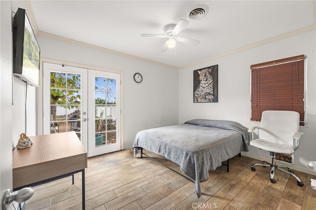 3620 Hoover Street Riverside, CA 92504 - Photo 13 of 44 a bedroom with a bed and wooden floor