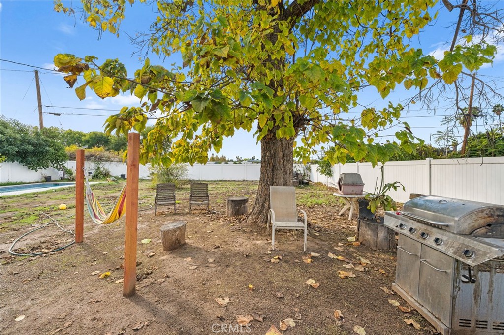 3620 Hoover Street Riverside, CA 92504 - Photo 29 of 44 a view of a patio with table and chairs and potted plants