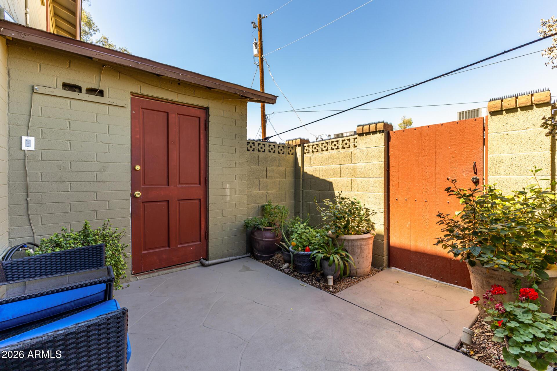 4615 North 39th Avenue, Unit 23 Phoenix, AZ 85019 - Photo 11 of 15 a front view of a house with a garden
