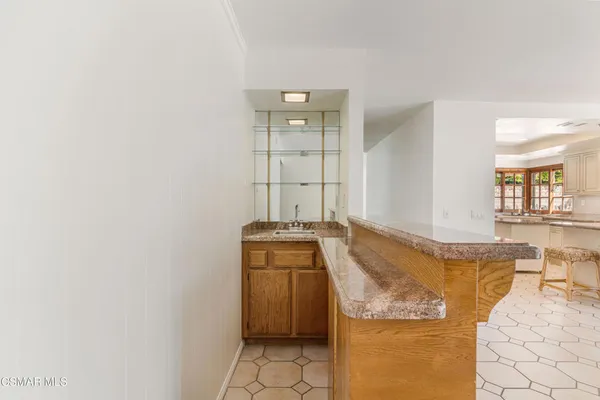 a room with a sink and storage