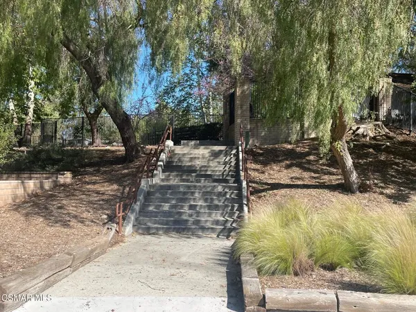 a view of a backyard of the house
