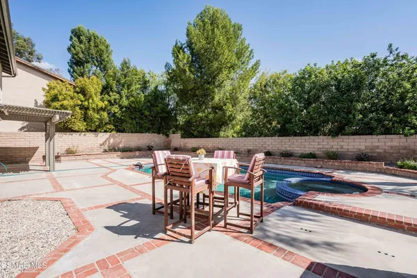 a view of a swimming pool with a patio