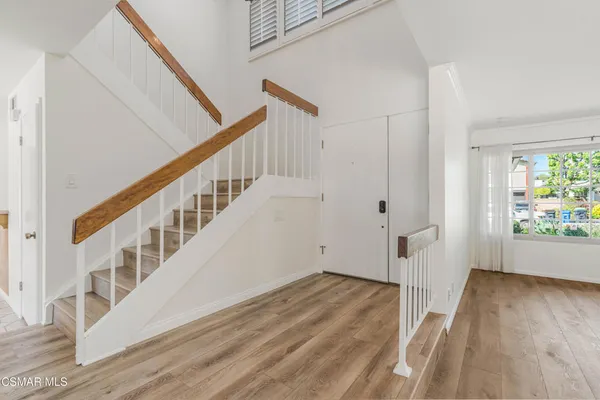 a view of entryway with wooden floor