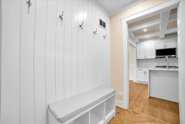 a view of cabinets with wooden floor and window