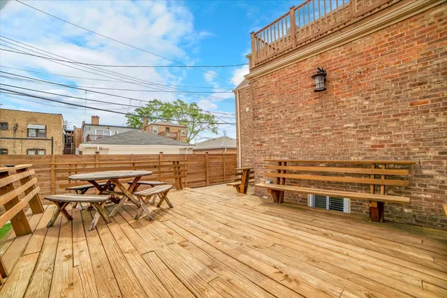 a view of a terrace with wooden floor and outdoor seating