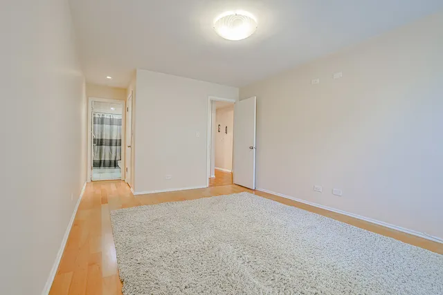 a bathroom with a sink a toilet and shower curtain