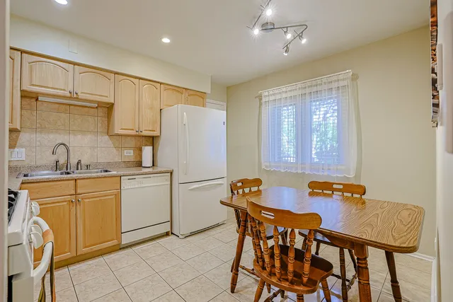 a view of a dining room with furniture and a window