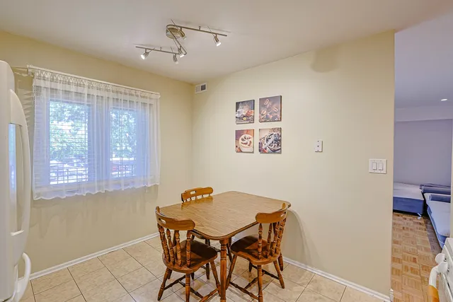 a kitchen with a stove and a refrigerator